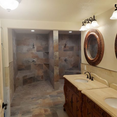 bathroom interior with showers